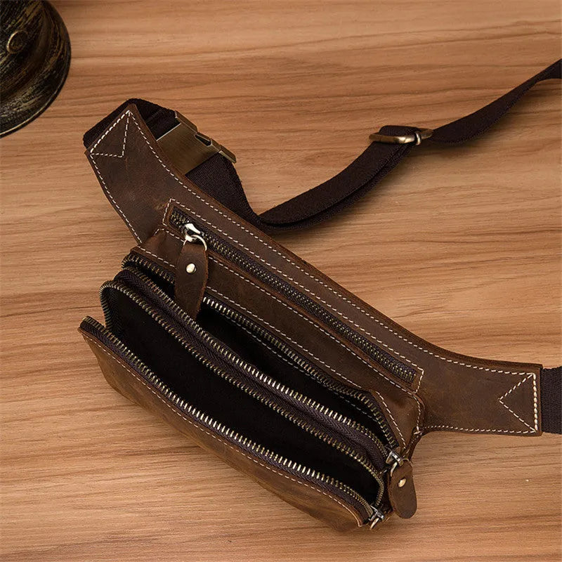 Brown top layer cowhide men's sports waist bag with a pull closure.
