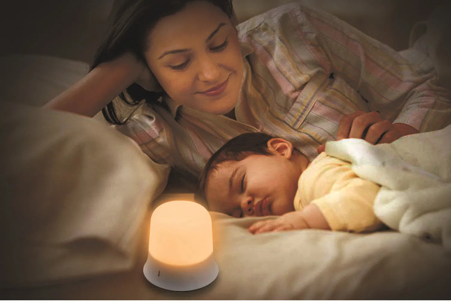 White rechargeable touch control night light with dimmer and motion sensor on a bedside table.