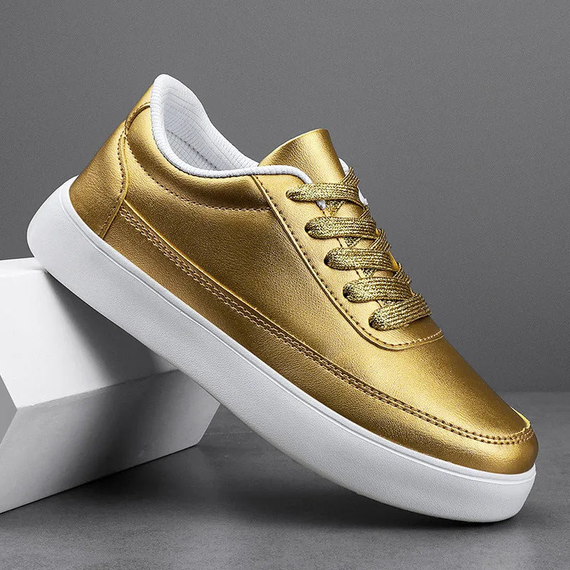 Women's white leather lace-up casual flat trainers on a plain background.