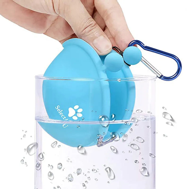 Yellow silicone pouch with hook-and-loop closure for dog treats, shown on a waistband.