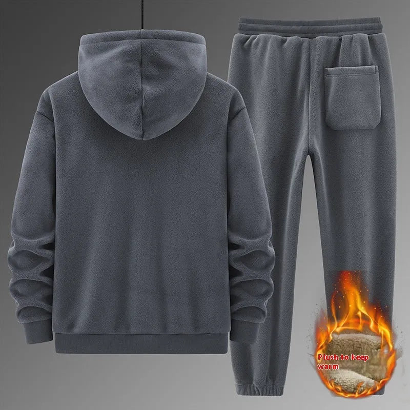 Casual grey sports suit set with a hooded cashmere-feel sweater and matching cotton-look pants on a hanger.