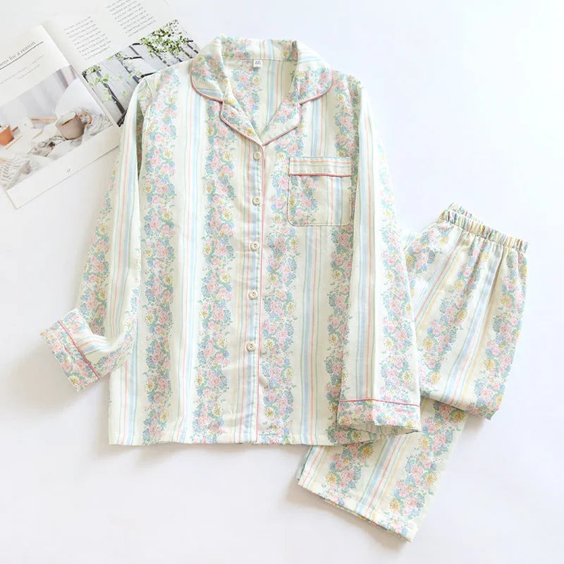 Women's striped cotton gauze long-sleeved top and matching trousers two-piece lounge set laid flat.
