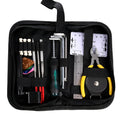 Black guitar repair tool kit open to show metal and plastic maintenance tools for guitars and other string instruments.