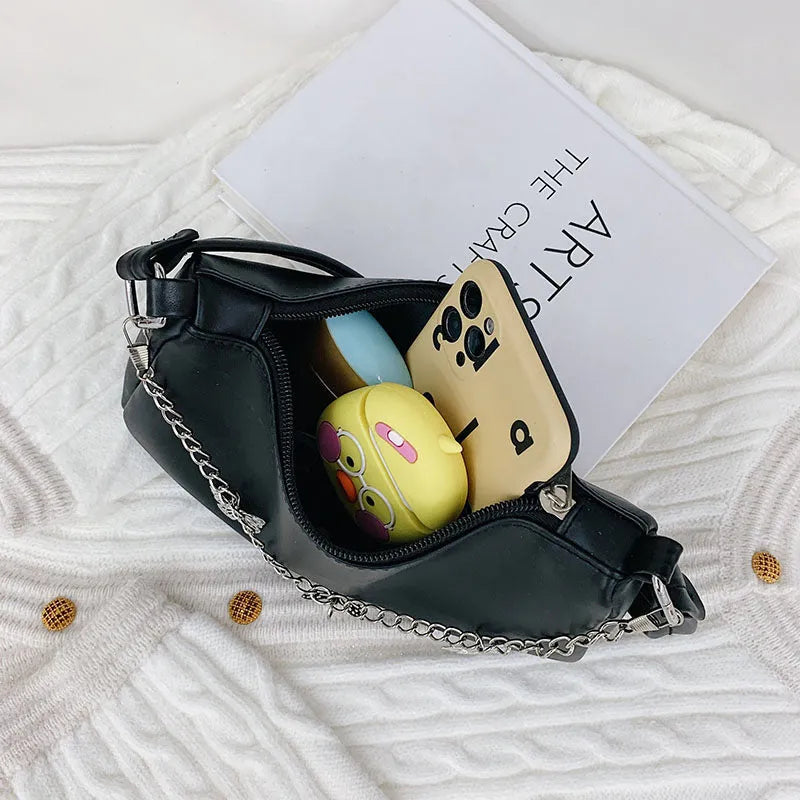 Retro-style square crossbody handbag with a butterfly clasp on its chain strap.