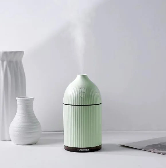 White ultrasonic aromatherapy diffuser and humidifier with LED light, 80mm diameter