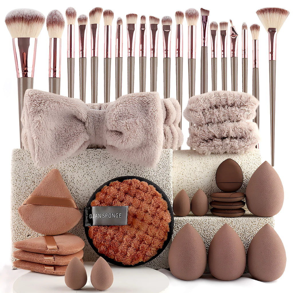 Beauty tool combination set with multiple pieces in pink, brown and purple colours for face wash and makeup application
