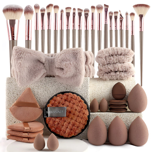 Beauty tool combination set with multiple pieces in pink, brown and purple colours for face wash and makeup application