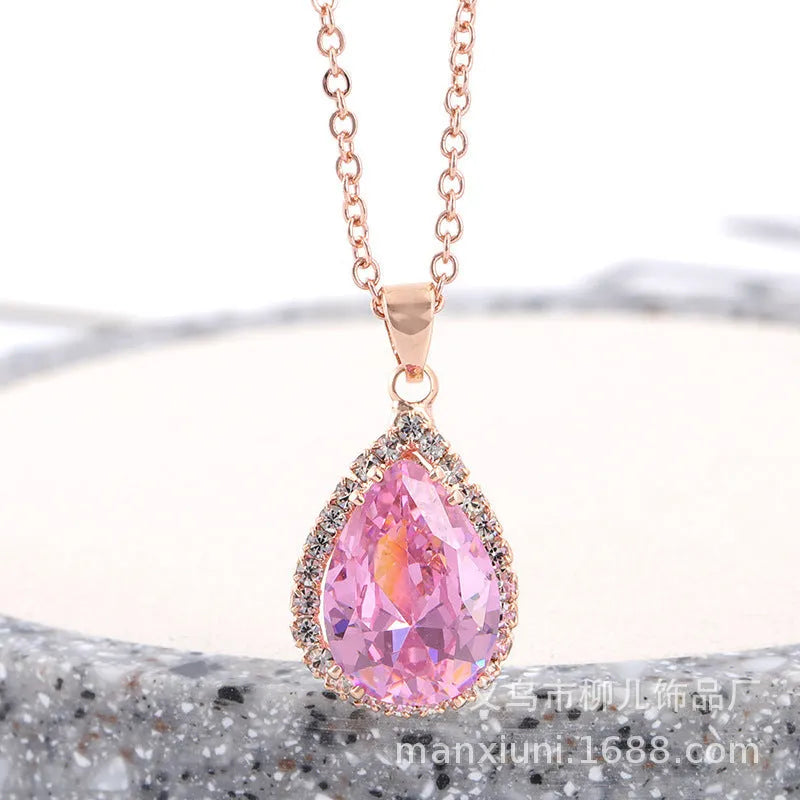 Rose gold plated drop pendant necklace with colourful rhinestones in a pink colour option.