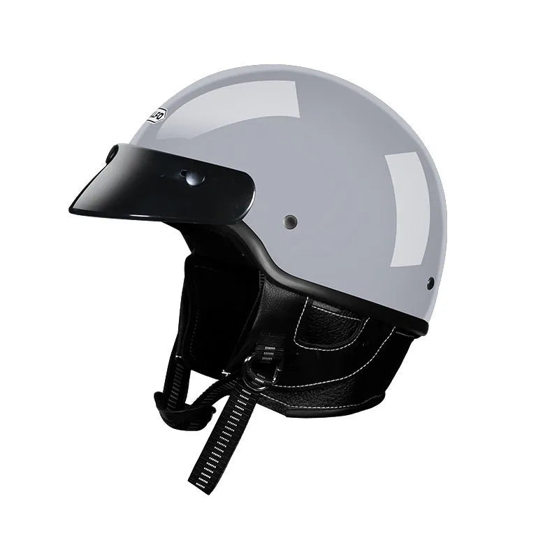 Retro-style motorcycle helmet on a solid background showing Ivory White, Starry Sky Black, Matte Black, and Cement Grey colour options.