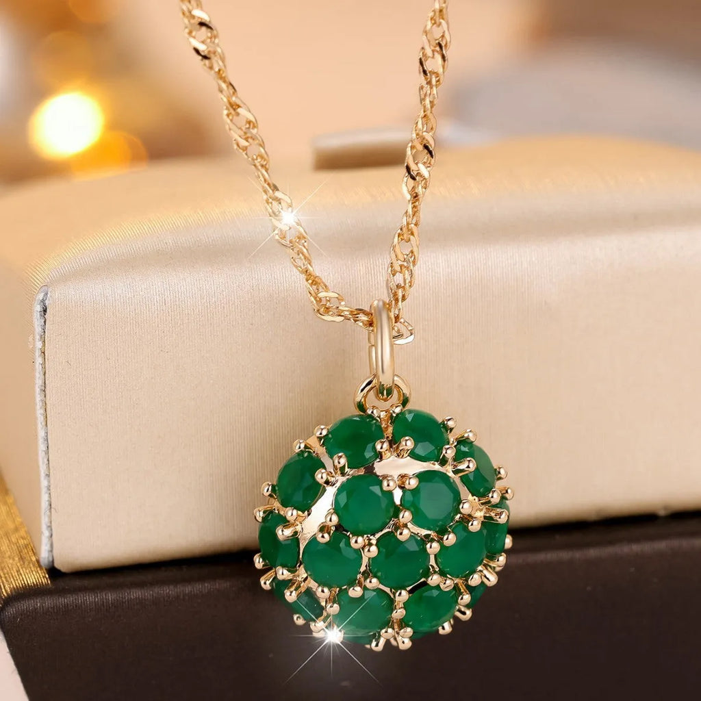 Round emerald and diamond pendant necklace in champagne gold colour on copper chain