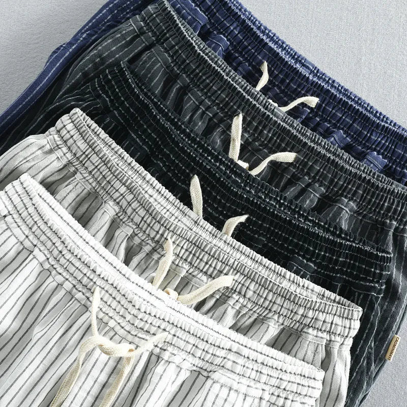 Men's striped casual cotton shorts with an elastic waistband shown in multiple colour options.