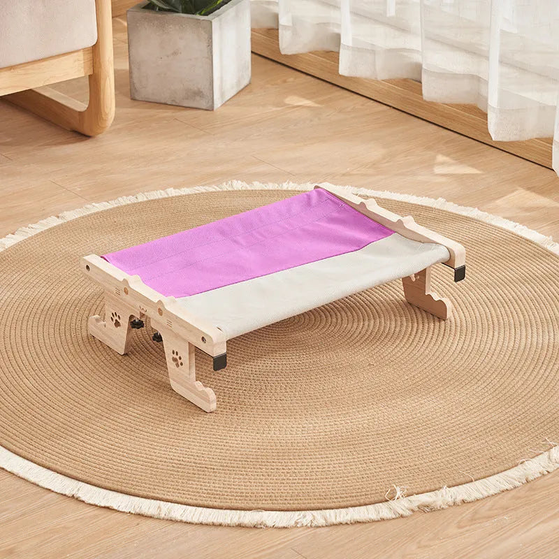 Wooden cat hanging bed hammock mounted on a balcony railing