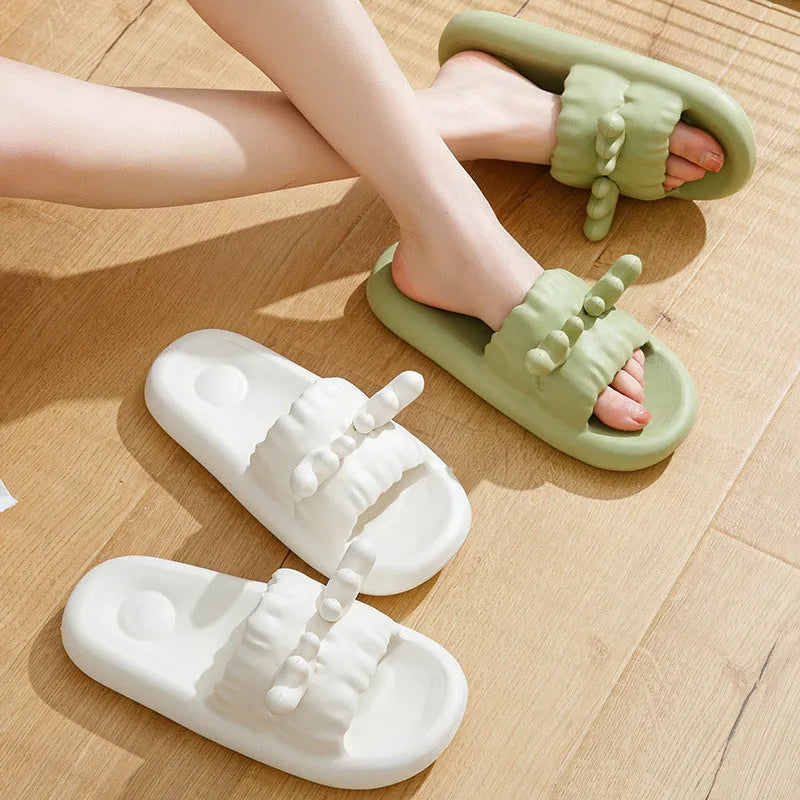 White women's flip flop slippers with deer horn design and hollow-out EVA upper on a light background.