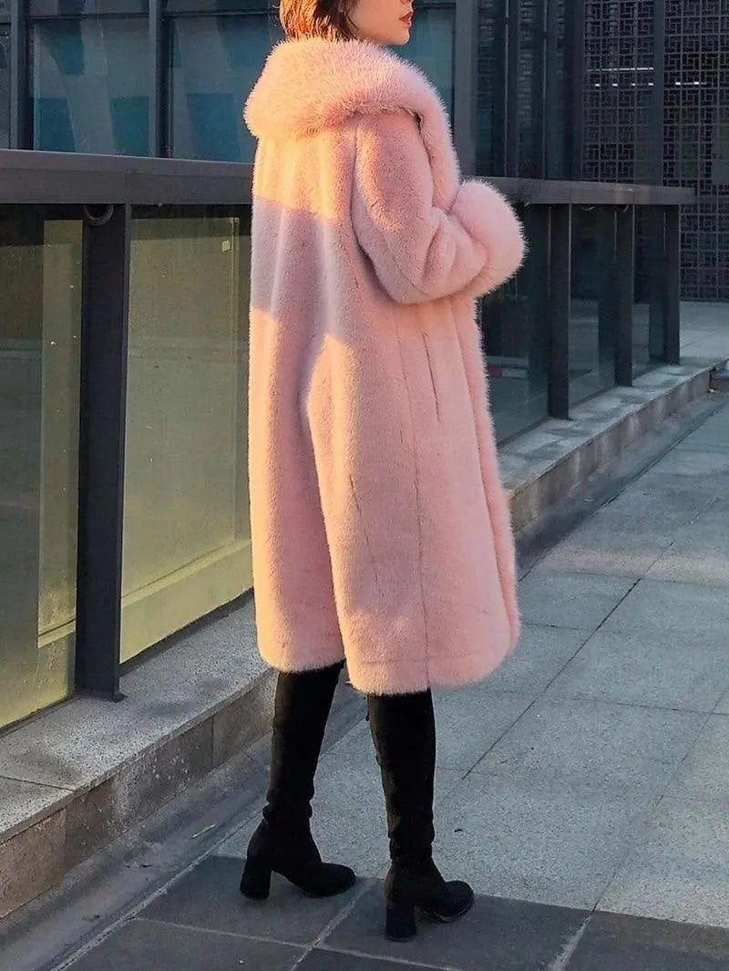 Grey women's thick faux rabbit fur mid-length coat with a fur collar on a hanger.