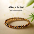 Tigereye stone bracelet with geometric design in Chinese style, showing bead details
