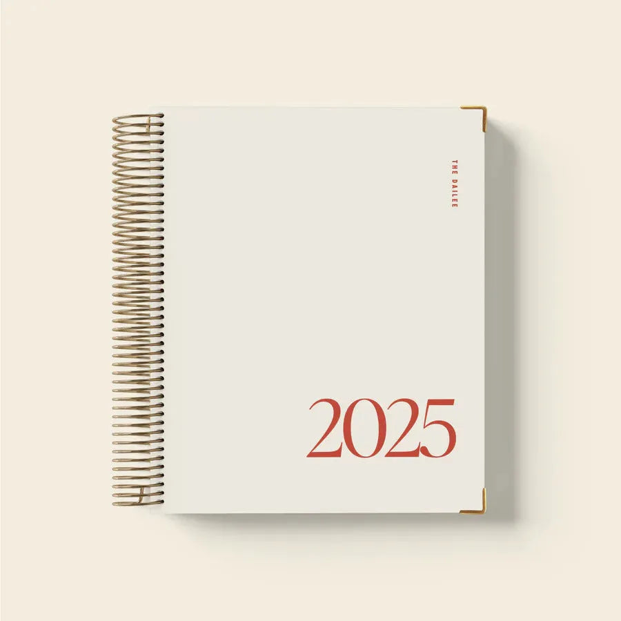 Cherry red coil notebook with spiral binding open to show paper pages