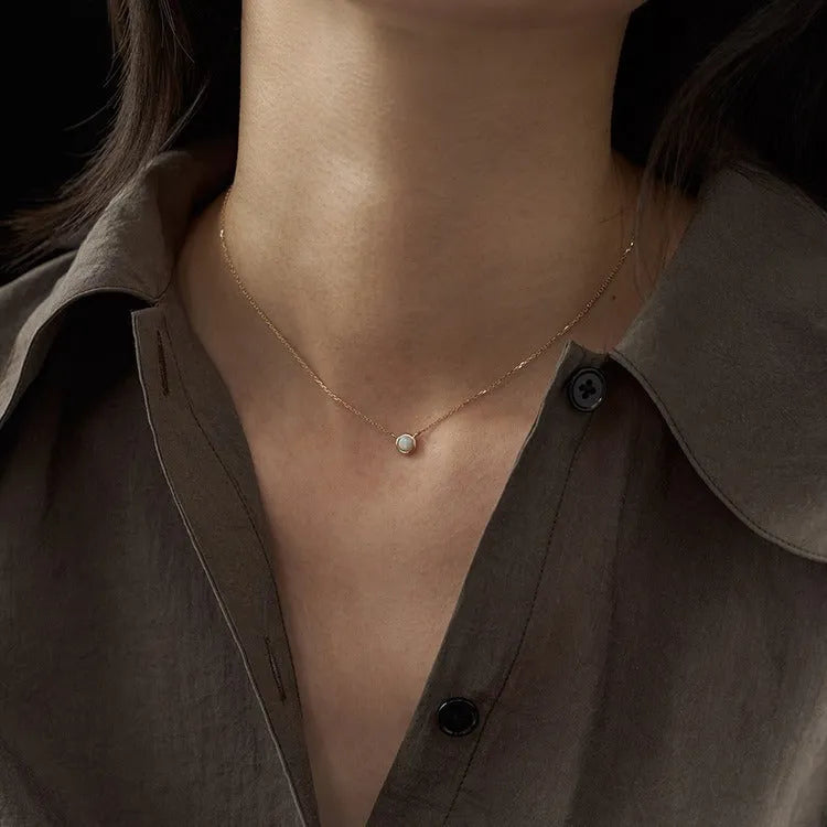 Geometric jelly opal pendant on a chain, made from 925 silver with gold or white gold plating.