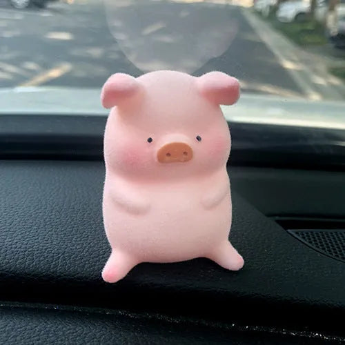 Cute cartoon pig resin figurine designed as a car dashboard decoration accessory.