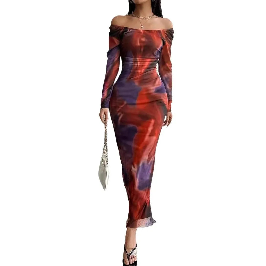 Long green mesh fishtail evening dress with a square collar, pleats, and a side split.