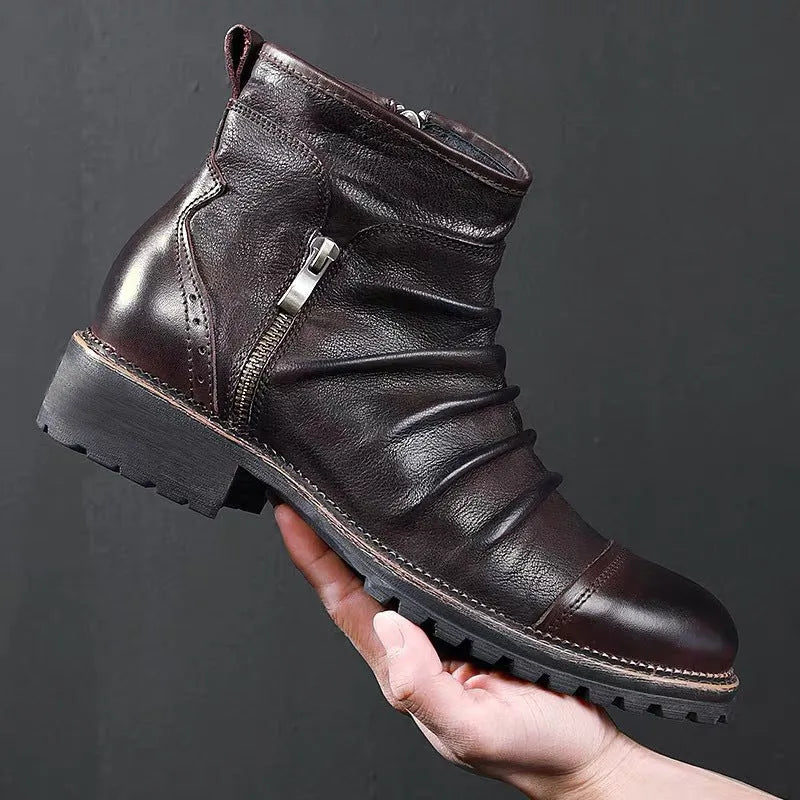 Brown mid-calf cowboy boots with side zipper, round toe, and horseshoe heel on wooden floor