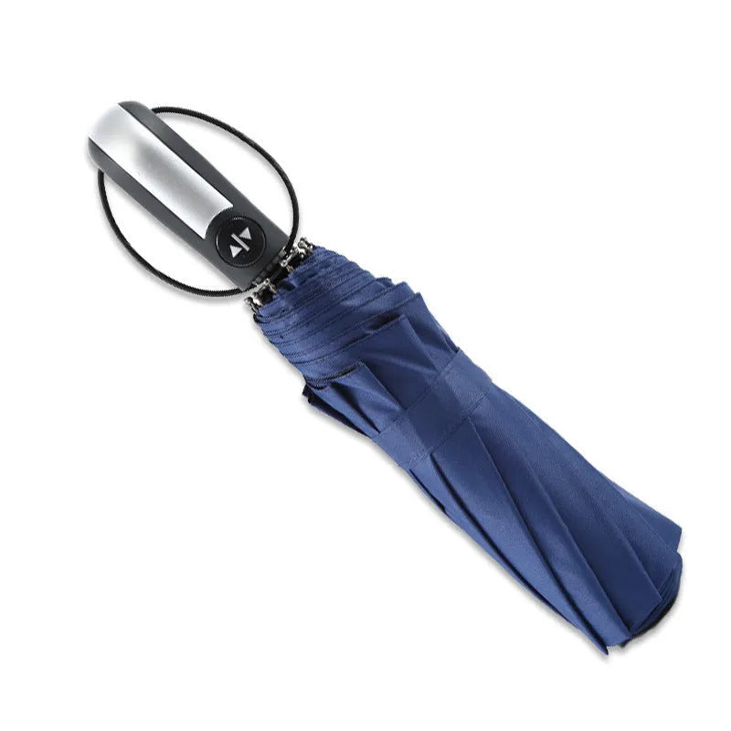 Triple-fold automatic open business umbrella in black, showing palace-style shape and rubber handle.