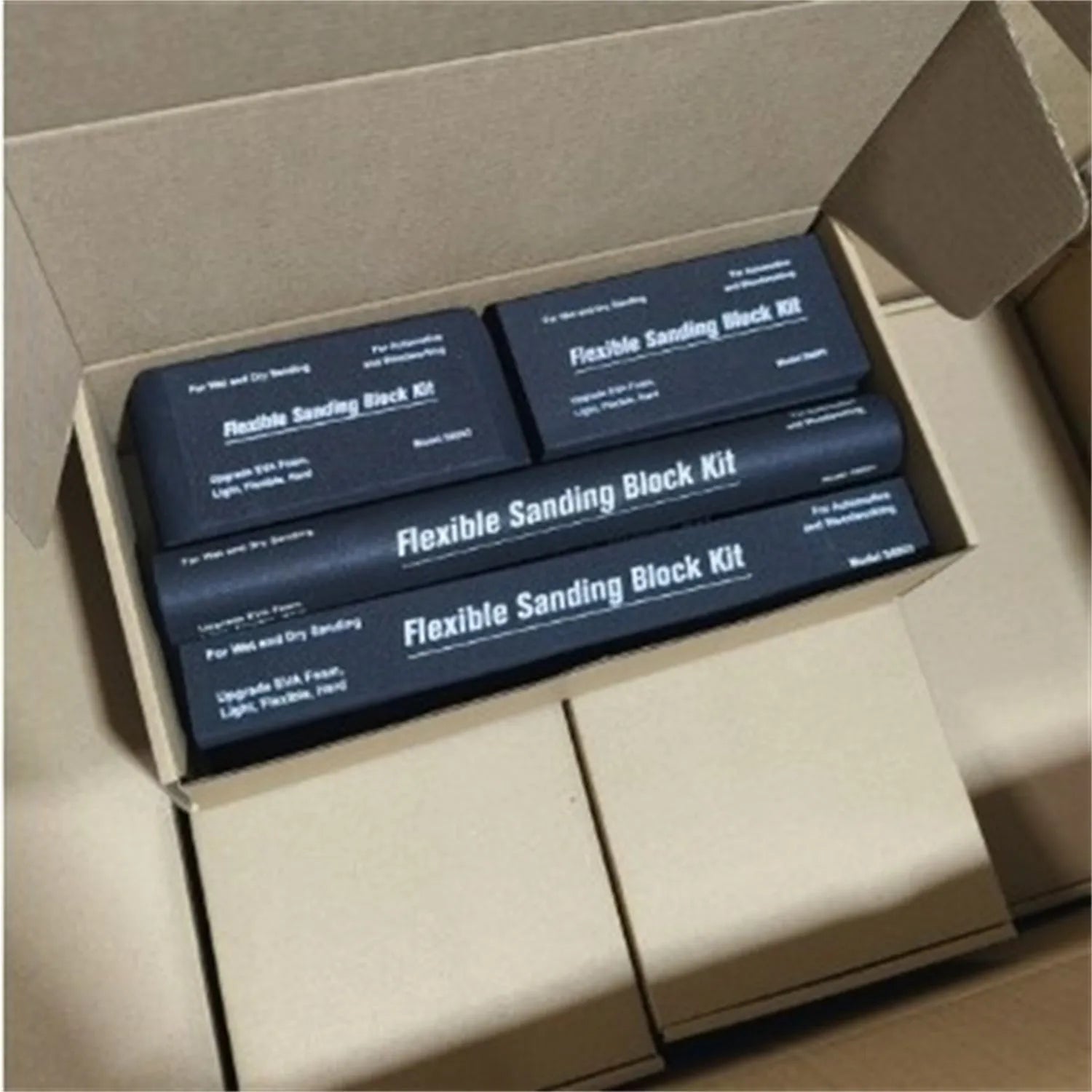 Set of seven black metal frosted blocks for craft and modelling work.
