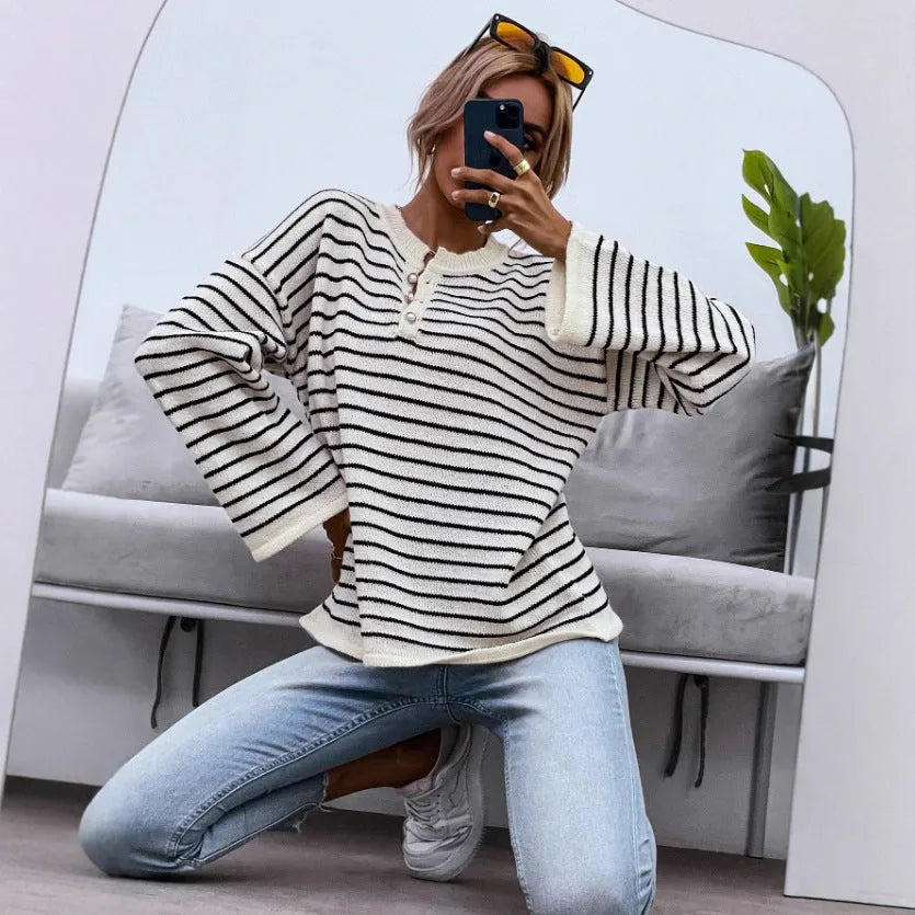 Black and white striped women's casual top with contrast colour detailing and drop-shoulder sleeves
