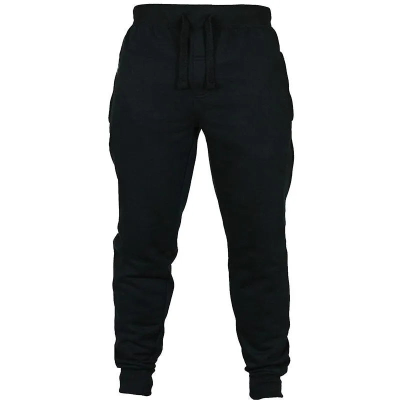 Men's black cotton fleece drawstring jogger pants laid flat, showing loose fit and flat front design.