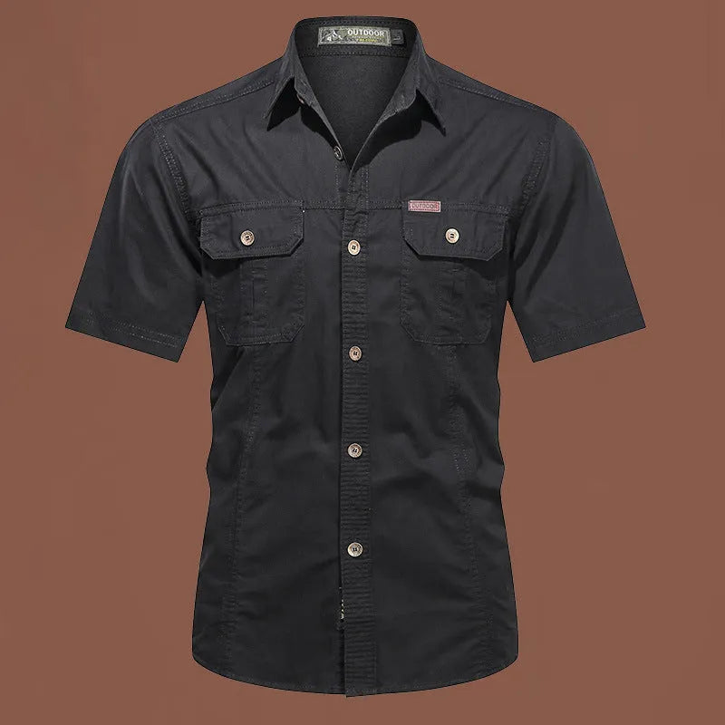 Men's army green cotton work shirt with short sleeves and a loose, non-iron fit.