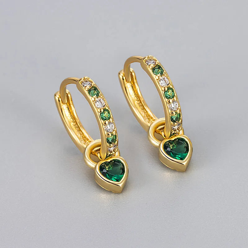 Women's heart-shaped ear clips with a coloured stone, available in gold or white gold colour.