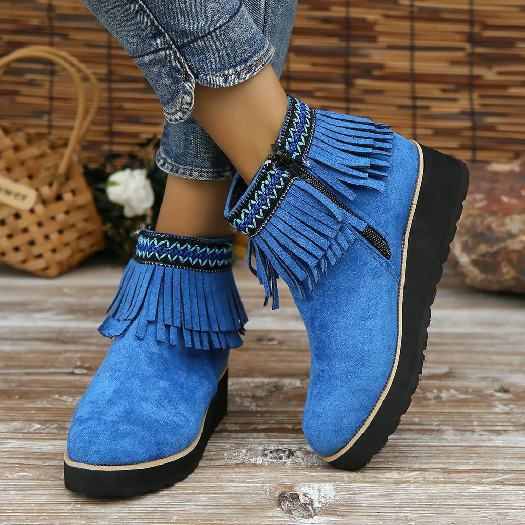 Women's black suede wedge ankle boots with side zip, tassel, and thick rubber sole.