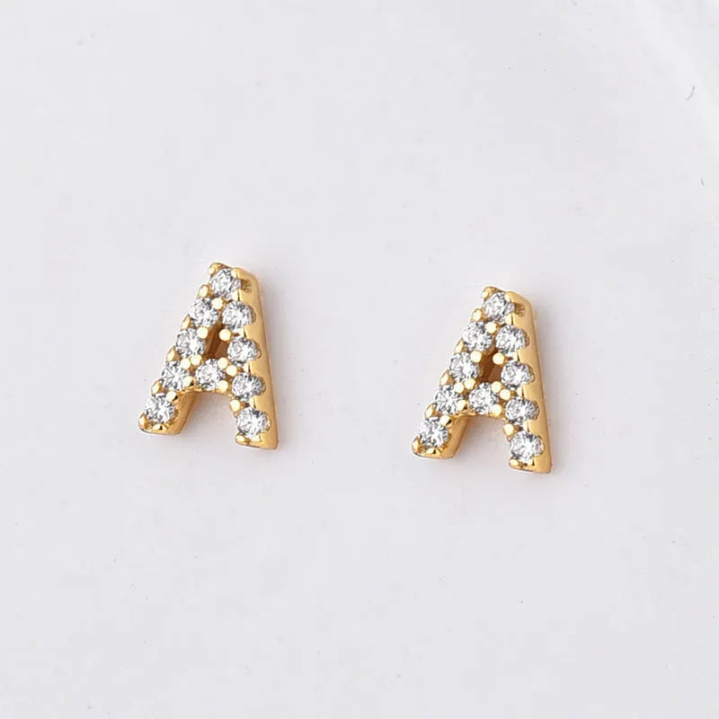Gold plated brass alphabet letter earrings with zircon detailing showing A-Z character range