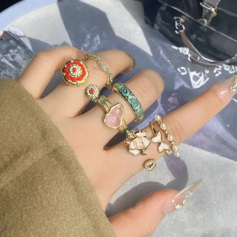 Copper adjustable ring with gourd design, flower and bow shapes, inlaid zircon detailing