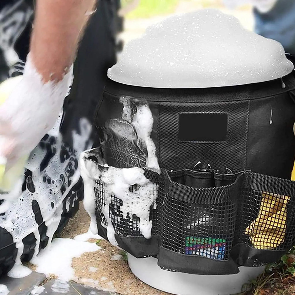 Black cylindrical polyester hanging storage bag fitted on a 5 gallon drum, holding car washing tools.