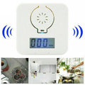 White wall-mounted wireless carbon monoxide alarm for detecting coal stove gas.
