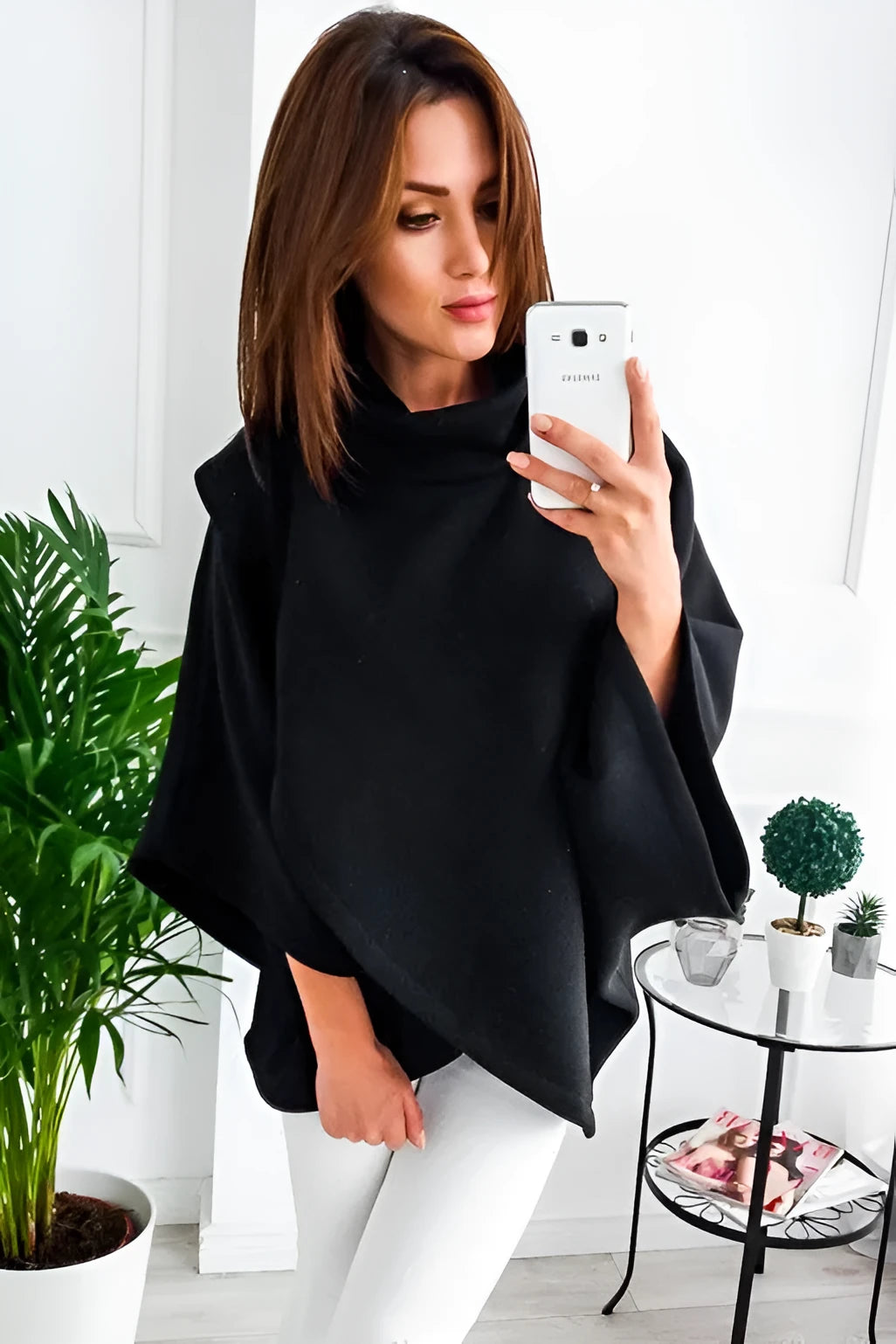 Women's long black cardigan sweatshirt with batwing sleeves and stitching detail, shown as a faux two-piece.