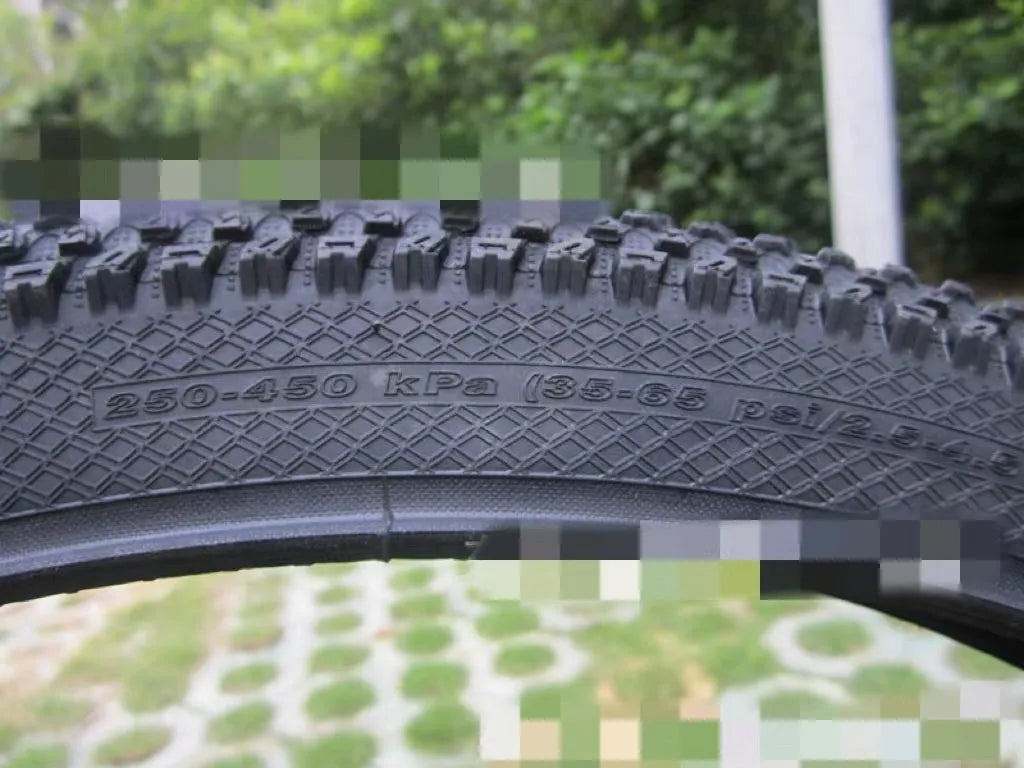 Ultralight puncture-proof mountain bike tyre shown in black with aggressive tread pattern.