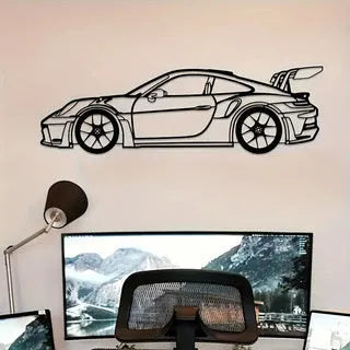 Black iron metal sports car wall art decoration against a wall