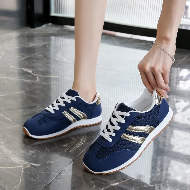 Blue women's casual tennis shoes with cross shoulder straps and rubber soles