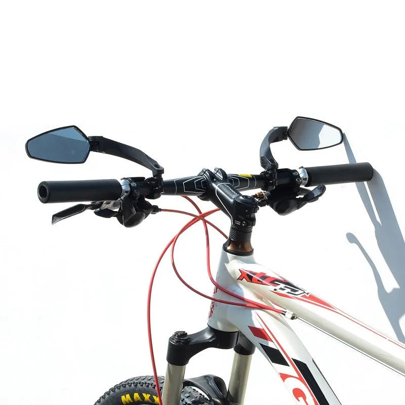 Black bicycle rearview mirror with wide 210mm acrylic lens mounted on a handlebar.
