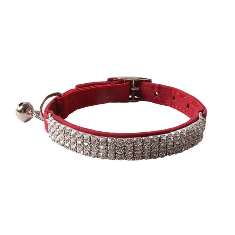 Colourful flocking fabric cat collar with elastic buckle shown in pink, black, and blue options