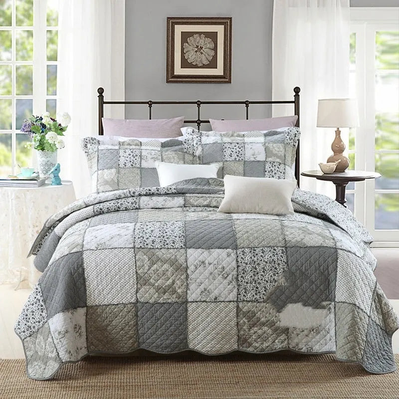 Pure cotton quilted bedspread and pillowcase set in a chosen pattern, laid flat on a bed.