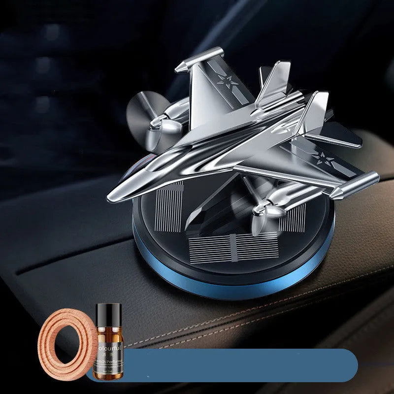 Solar powered rotating silver fighter jet perfume ornament with aluminium alloy seat and essential oil.