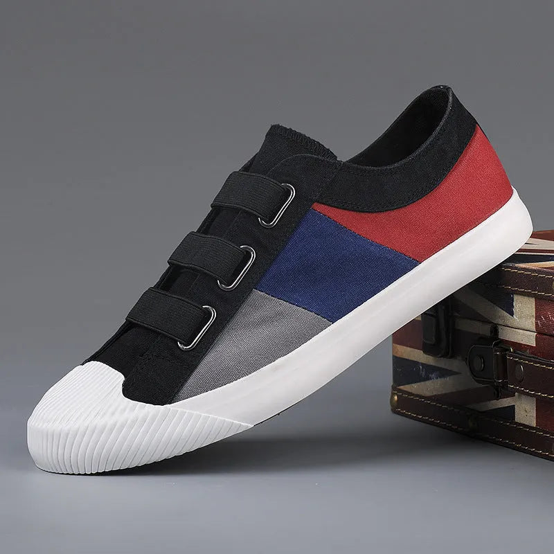 Men's beige canvas low-top sneakers with elastic band closure and a flat rubber sole