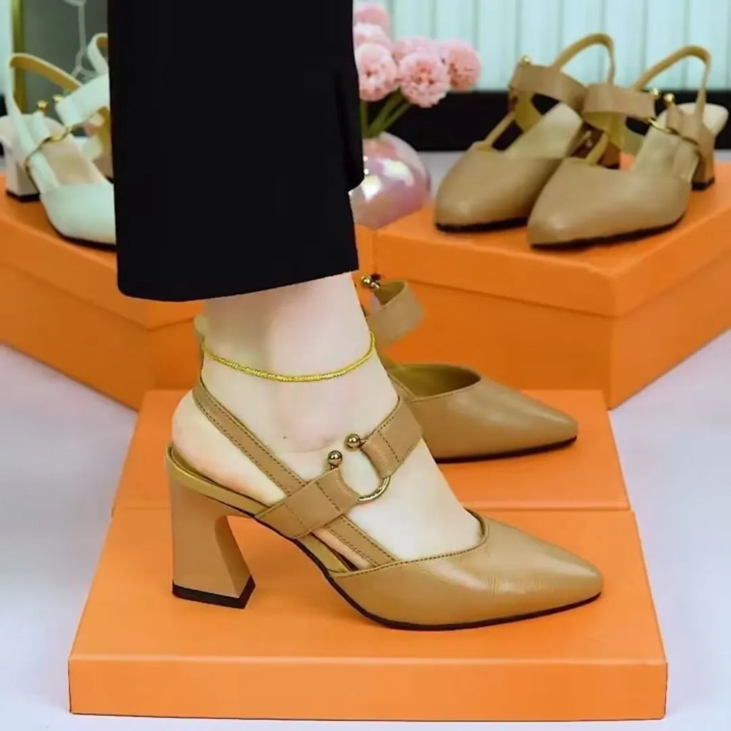 Women's black closed toe leather sandals with a chunky block heel and strapless slip-on design.