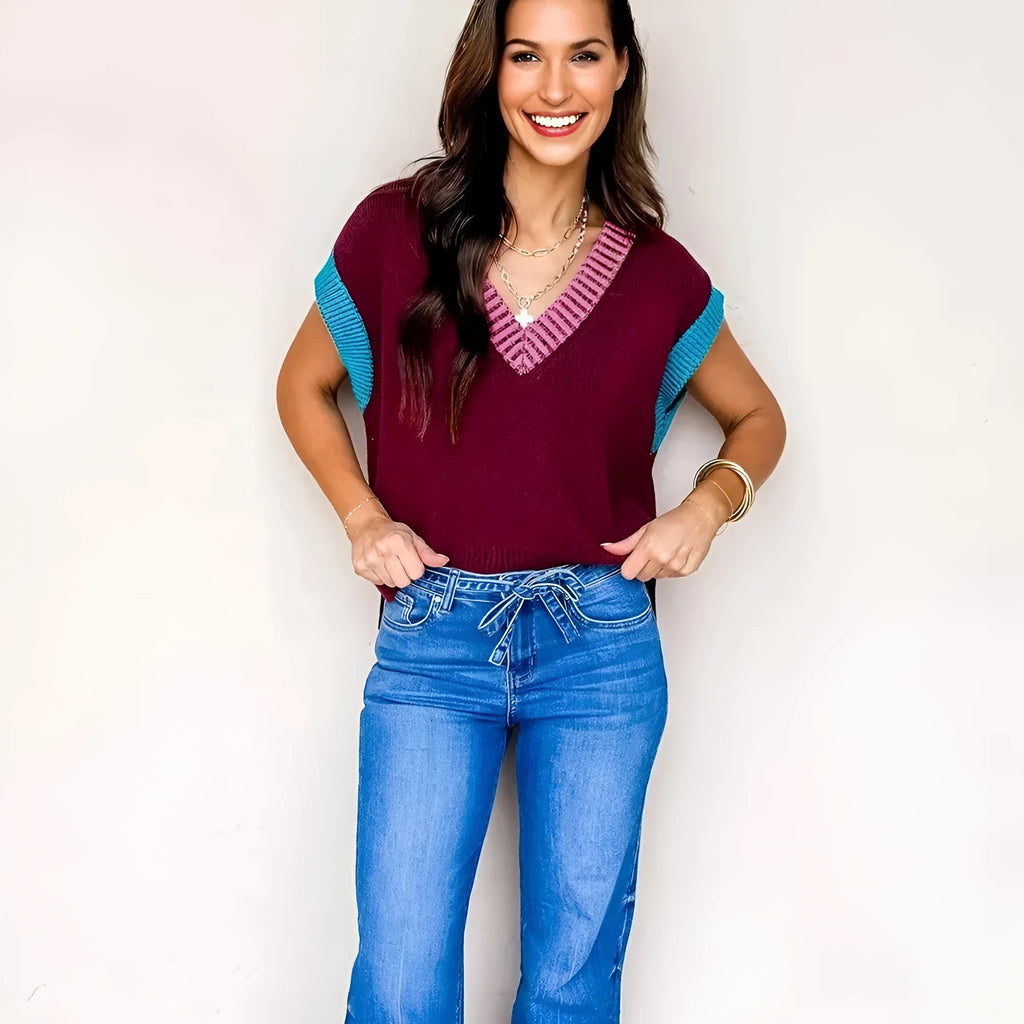 Burgundy women's loose V-neck sweater with contrast trim and cuffed short sleeves.