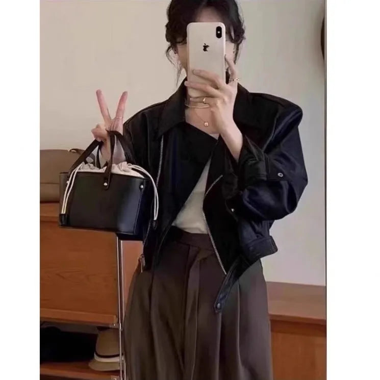 Women's brown retro imitation leather jacket with long sleeves, pockets, and a slim fit.