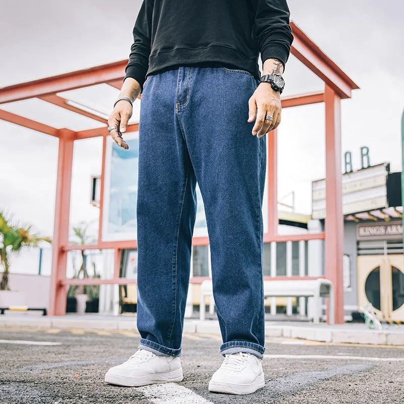 Men's loose straight cotton jeans in dark blue, light blue, and grey colours with mid-rise waist