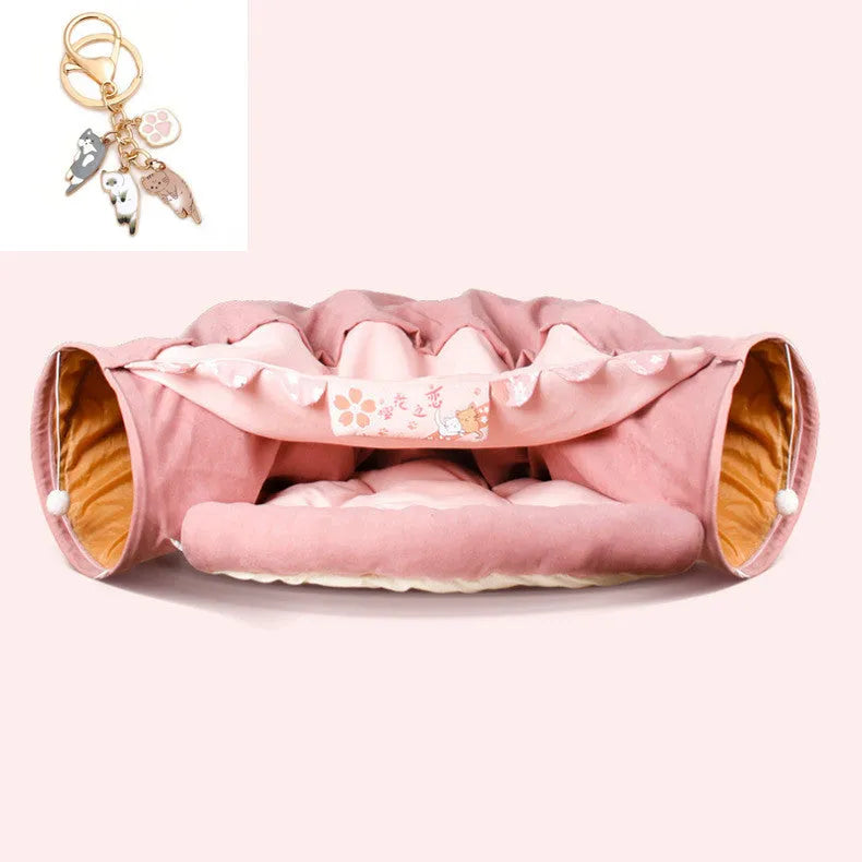 Collapsible cloth cat tunnel toy in pink, shown folded flat and opened for play