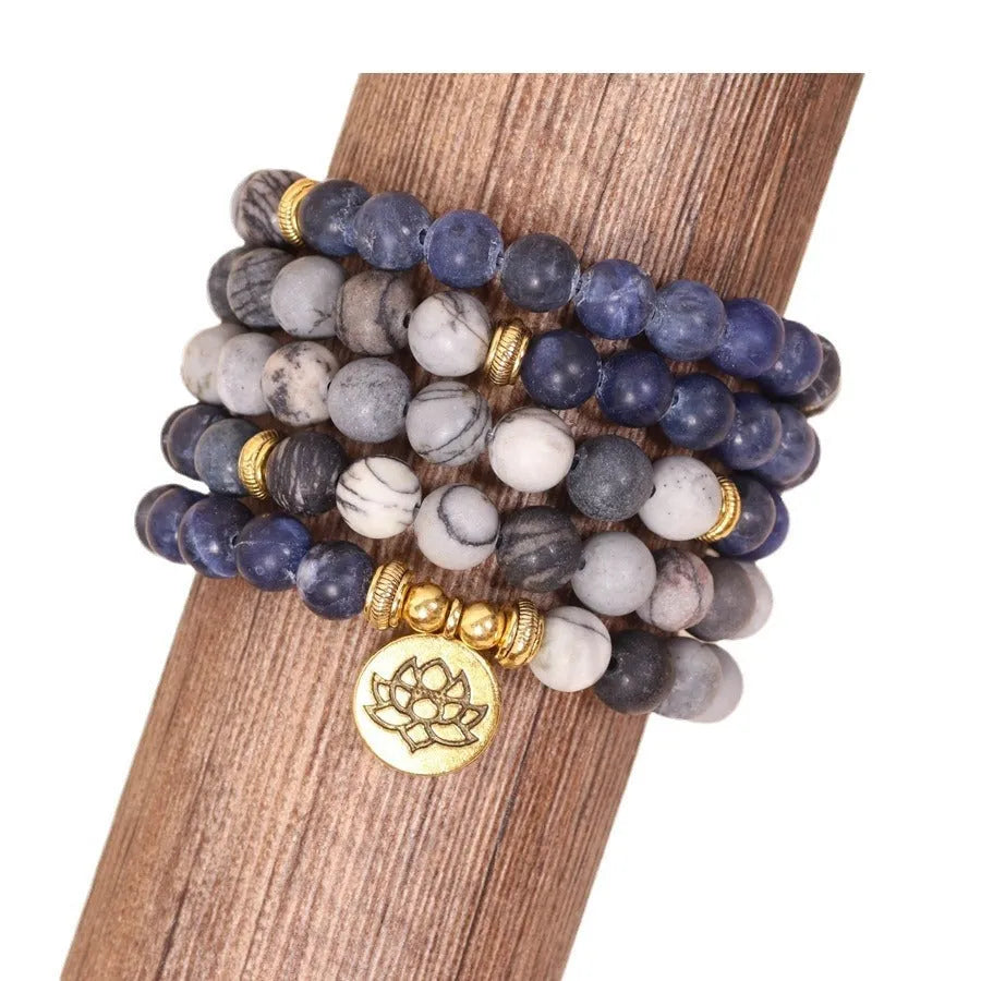 Blue patterned network stone beads on a multi layer alloy chain bracelet